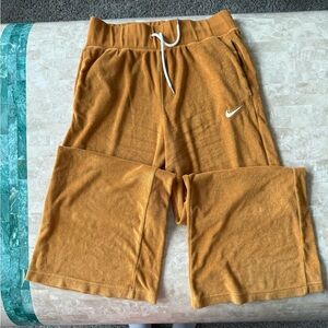 Gold Nike bell bottom style sweat pants